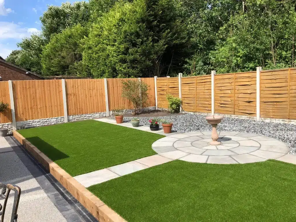 Rock garden with conifers, slate chippings and timber sleeper steps