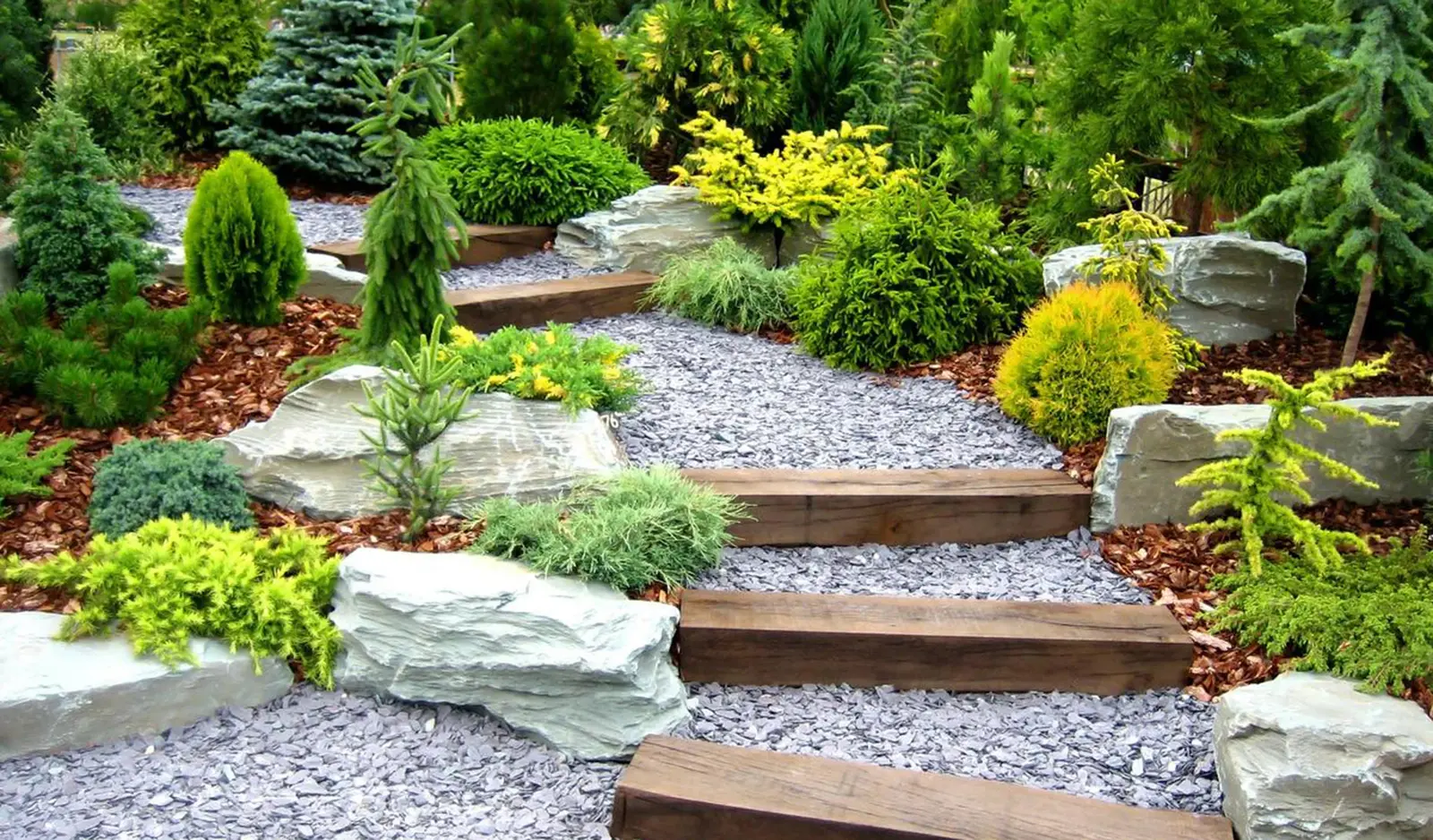 Modern garden with fresh lawn, circular patio feature and new fencing